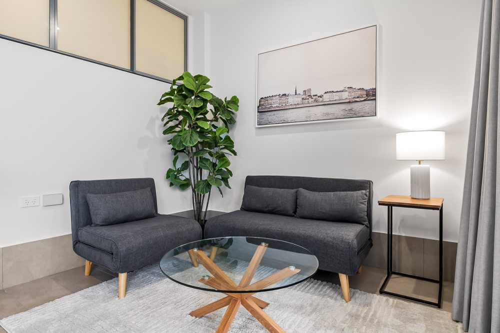 Two dark grey lounges in the lounge/office space